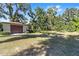 Detached garage with a large grassy yard in front at 3590 Sw 24Th Avenue Rd, Ocala, FL 34471