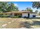Ranch-style home with a large backyard and mature landscaping at 3590 Sw 24Th Avenue Rd, Ocala, FL 34471