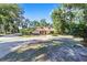 Ranch style home with circular driveway, mature trees at 3590 Sw 24Th Avenue Rd, Ocala, FL 34471
