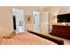 Spacious main bedroom with ensuite bathroom access and a dresser at 3642 Nw 55Th Cir, Ocala, FL 34482