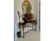 Ornate entry table with mirror and decorative accents at 3642 Nw 55Th Cir, Ocala, FL 34482