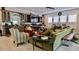 Relaxing living room with green sectional sofa and built-in shelving at 3642 Nw 55Th Cir, Ocala, FL 34482