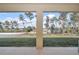 Covered patio overlooking a spacious backyard with trees at 4313 Sw 106Th Pl, Ocala, FL 34476