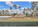 Spacious backyard with a view of lush trees and a white fence at 4313 Sw 106Th Pl, Ocala, FL 34476