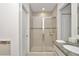 Bathroom with shower and granite countertop at 4313 Sw 106Th Pl, Ocala, FL 34476