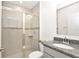 Bathroom with shower and granite countertop at 4313 Sw 106Th Pl, Ocala, FL 34476