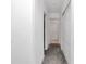 Clean hallway with carpet and access to multiple rooms at 4313 Sw 106Th Pl, Ocala, FL 34476