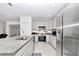 Modern kitchen with stainless steel appliances and granite countertops at 4313 Sw 106Th Pl, Ocala, FL 34476