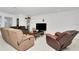Relaxing living room with reclining sofas and large TV at 4313 Sw 106Th Pl, Ocala, FL 34476