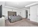 Spacious main bedroom with plush carpeting and large bed at 4313 Sw 106Th Pl, Ocala, FL 34476
