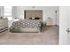 Spacious main bedroom with plush carpeting and large bed at 4313 Sw 106Th Pl, Ocala, FL 34476