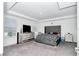 Spacious main bedroom with plush carpeting and large bed at 4313 Sw 106Th Pl, Ocala, FL 34476
