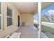 Covered patio with seating area and access to the backyard at 4313 Sw 106Th Pl, Ocala, FL 34476