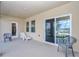 Relaxing covered patio with sliding glass doors and outdoor seating at 4313 Sw 106Th Pl, Ocala, FL 34476