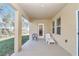Covered patio with seating area and backyard access at 4313 Sw 106Th Pl, Ocala, FL 34476