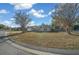 House exterior with lawn and trees at 5570 Se 42Nd Ave, Ocala, FL 34480