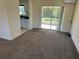 Living room with kitchen and patio access at 6011 Sw 98Th Street Rd, Ocala, FL 34476