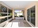 Relaxing screened porch with sliding glass doors at 6011 Sw 98Th Street Rd, Ocala, FL 34476