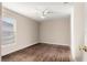 Spacious bedroom with dark wood flooring and ceiling fan at 6560 Sw 129Th St, Ocala, FL 34473
