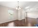 Bright dining room features hardwood floors and a large window at 6560 Sw 129Th St, Ocala, FL 34473