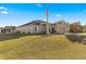 Single story house with American flag, landscaping, and driveway at 6560 Sw 129Th St, Ocala, FL 34473