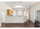 Open kitchen with light wood cabinets and a breakfast bar at 6560 Sw 129Th St, Ocala, FL 34473