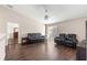 Spacious living room featuring hardwood floors and access to other rooms at 6560 Sw 129Th St, Ocala, FL 34473