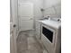 Convenient laundry room with washer, dryer, and overhead shelving at 9118 Sw 62Nd Terrace, Ocala, FL 34476