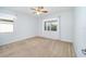 Spacious bedroom with ceiling fan and neutral carpeting at 9744 Sw 63Rd Loop, Ocala, FL 34481