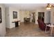 Living room with tile floors, two recliners, and a view into the dining area at 10886 Sw 90Th Ter, Ocala, FL 34481