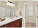 Bathroom with double vanity and a separate toilet area at 3225 Nw 79Th Avenue Rd, Ocala, FL 34482