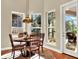 Bright breakfast nook with a table and chairs, adjacent to the kitchen and offering backyard views at 3225 Nw 79Th Avenue Rd, Ocala, FL 34482