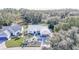 Aerial view of a house and surrounding landscape at 3923 Manor Oaks Ct, Leesburg, FL 34748