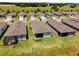 Aerial view of homes with backyards and screened patios at 6035 Sw 93Rd Cir, Ocala, FL 34481