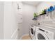 Convenient laundry room with washer, dryer, and shelving at 6035 Sw 93Rd Cir, Ocala, FL 34481