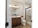 Modern bathroom with walk-in shower and wood-look tile floor at 8375 Sw 98Th Ave, Ocala, FL 34481