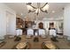 Formal dining room with rustic table and white chairs at 8375 Sw 98Th Ave, Ocala, FL 34481