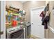 Bright laundry room with washer, dryer, and ample shelving at 9083 Sw 99Th Court Rd, Ocala, FL 34481