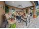 Covered patio with comfortable seating and views of the kitchen at 9146 Sw 65Th Loop, Ocala, FL 34481