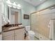 Clean bathroom with a walk-in shower and granite countertop at 9146 Sw 65Th Loop, Ocala, FL 34481