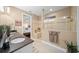 Spa-like bathroom with a walk-in shower, double vanity, and neutral tile at 9146 Sw 65Th Loop, Ocala, FL 34481