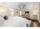 Main bedroom with hardwood floors, a ceiling fan, and neutral decor at 9146 Sw 65Th Loop, Ocala, FL 34481