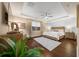 Main bedroom with hardwood floors, a ceiling fan, and a neutral color palette at 9146 Sw 65Th Loop, Ocala, FL 34481