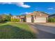 Beautiful two-story house with a three-car garage and manicured lawn at 9146 Sw 65Th Loop, Ocala, FL 34481