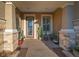 Inviting front porch with a decorative door and potted plants at 9146 Sw 65Th Loop, Ocala, FL 34481