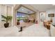 Open and airy indoor patio with sliding doors leading to outdoor patio and pool area at 9146 Sw 65Th Loop, Ocala, FL 34481