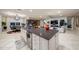 Modern kitchen with a large island, granite countertops, and breakfast bar at 9146 Sw 65Th Loop, Ocala, FL 34481