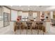 Large kitchen island with seating and dark countertops at 9146 Sw 65Th Loop, Ocala, FL 34481