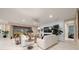 Living room with white sofas, a fireplace, and views of the backyard at 9146 Sw 65Th Loop, Ocala, FL 34481