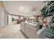 Open living room and kitchen with neutral tones and tile floors at 9146 Sw 65Th Loop, Ocala, FL 34481